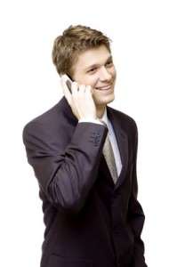 Handsome young man in suit on the phone